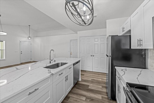 415 NW 10th St, Gainesville, FL 32601 - kitchen with a sink, dishwasher, white cabinets, and wood finished floors