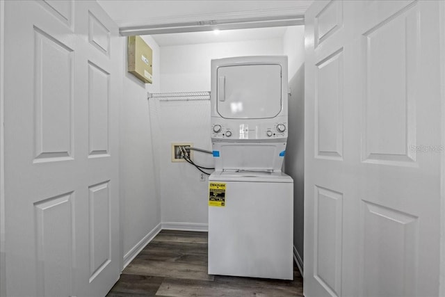 415 NW 10th St, Gainesville, FL 32601 - laundry area featuring stacked washer / drying machine and dark wood finished floors