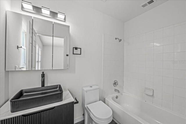 415 NW 10th St, Gainesville, FL 32601 - bathroom with toilet, washtub / shower combination, and a sink