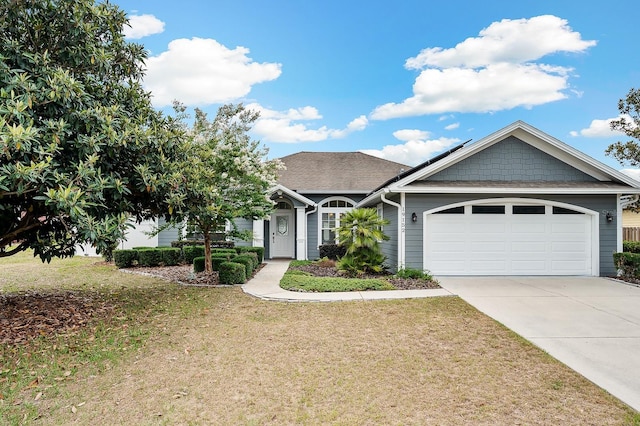 19152 NW 228th Way, High Springs, FL 32643 - view of front of home featuring a garage, concrete driveway, and a front yard