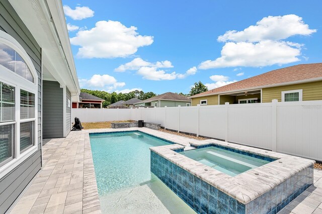 19152 NW 228th Way, High Springs, FL 32643 - view of pool with an in-ground hot tub, a fenced backyard, and a patio
