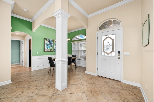 19152 NW 228th Way, High Springs, FL 32643 - entryway with decorative columns, crown molding, arched walkways, wainscoting, and baseboards