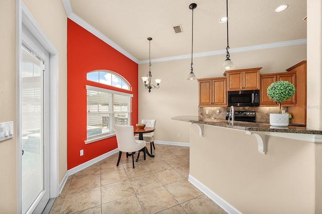 19152 NW 228th Way, High Springs, FL 32643 - kitchen featuring stainless steel microwave, black / electric stove, brown cabinetry, a kitchen breakfast bar, and decorative backsplash