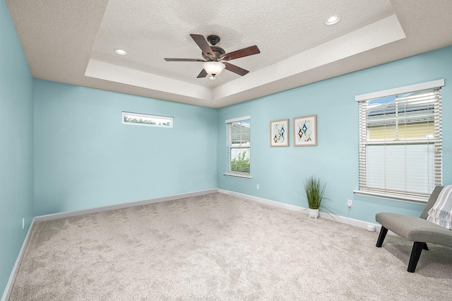 19152 NW 228th Way, High Springs, FL 32643 - unfurnished room with a tray ceiling, carpet flooring, a textured ceiling, baseboards, and recessed lighting