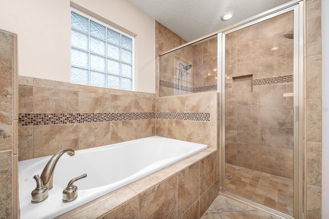 19152 NW 228th Way, High Springs, FL 32643 - full bath featuring a bath, a stall shower, a textured ceiling, and tile walls