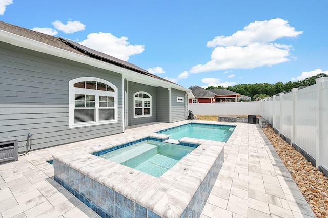 19152 NW 228th Way, High Springs, FL 32643 - view of pool featuring a patio area, a fenced backyard, and a pool with connected hot tub