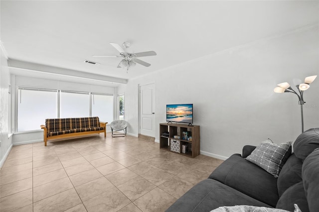 4023 SW 19th St, Gainesville, FL 32608 - living room with baseboards, light tile patterned floors, and ceiling fan