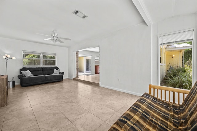 4023 SW 19th St, Gainesville, FL 32608 - living room featuring ceiling fan, light tile patterned floors, and baseboards