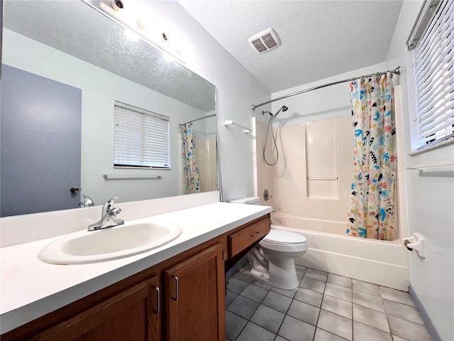 5830 SW 9th Pl, Gainesville, FL 32607 - full bathroom with tile patterned flooring, vanity, shower / bath combo, and toilet