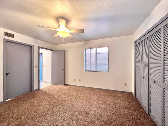 5830 SW 9th Pl, Gainesville, FL 32607 - unfurnished bedroom with carpet flooring, baseboards, and ceiling fan