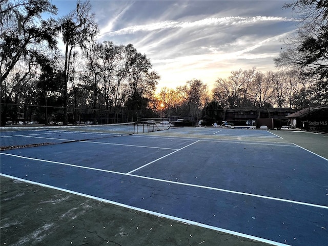 5830 SW 9th Pl, Gainesville, FL 32607 - view of tennis court featuring view of wooded area