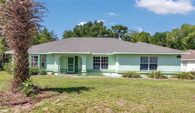 3968 SW 131st Place Rd, Ocala, FL 34473 - ranch-style house with stucco siding, a front lawn, and roof with shingles