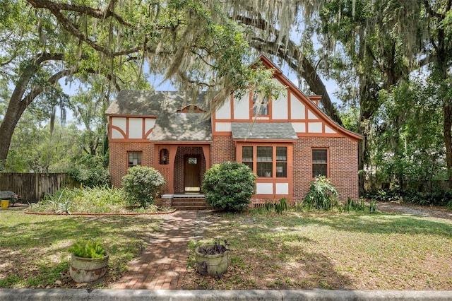 535 NE 9th Ave, Gainesville, FL 32601 - tudor house with brick siding and roof with shingles