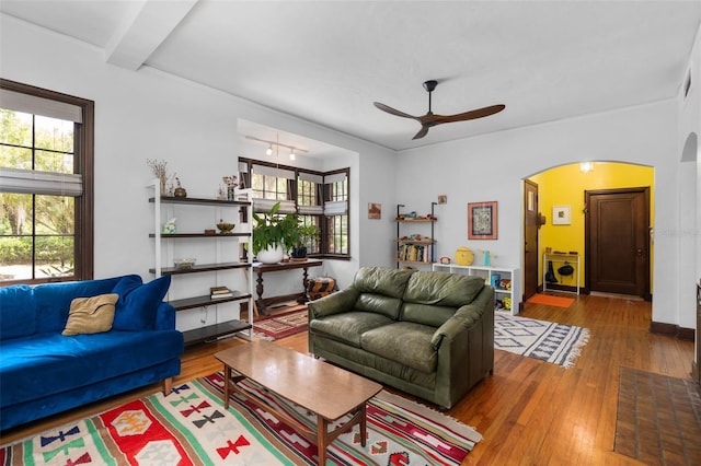 535 NE 9th Ave, Gainesville, FL 32601 - living area with arched walkways, ceiling fan, and hardwood / wood-style floors