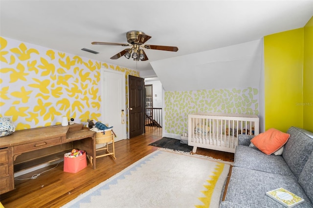 535 NE 9th Ave, Gainesville, FL 32601 - bedroom featuring wallpapered walls, wood finished floors, and a ceiling fan