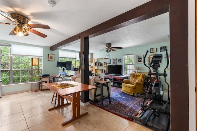535 NE 9th Ave, Gainesville, FL 32601 - living room with a ceiling fan, light tile patterned flooring, and beam ceiling