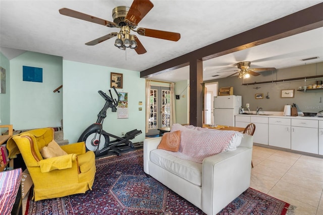 535 NE 9th Ave, Gainesville, FL 32601 - living area with ceiling fan, french doors, and light tile patterned floors