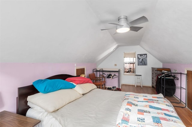 535 NE 9th Ave, Gainesville, FL 32601 - bedroom featuring wood finished floors, a ceiling fan, and lofted ceiling