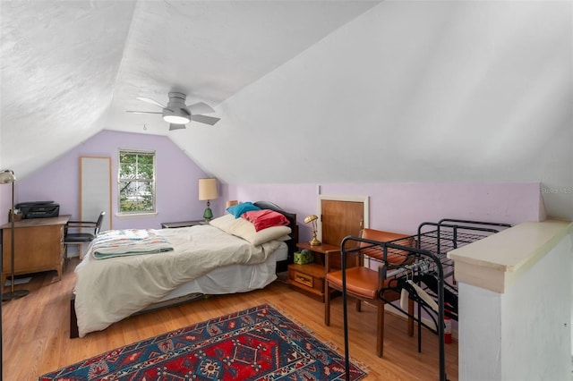 535 NE 9th Ave, Gainesville, FL 32601 - bedroom with vaulted ceiling, wood finished floors, and a ceiling fan