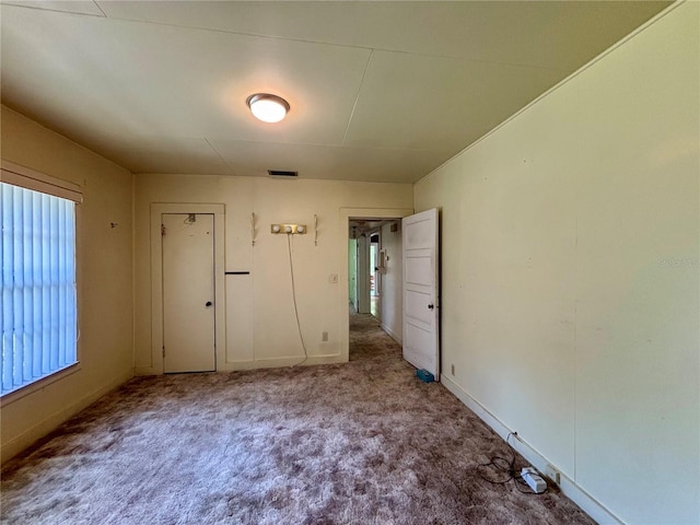unfurnished bedroom with carpet flooring