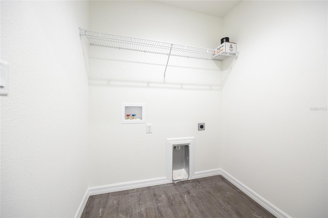 clothes washing area featuring hookup for an electric dryer, hookup for a washing machine, dark wood-style floors, and baseboards