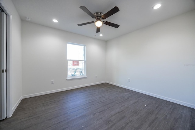 empty room featuring dark wood-style flooring, ceiling fan, baseboards, recessed lighting, and a smoke detector