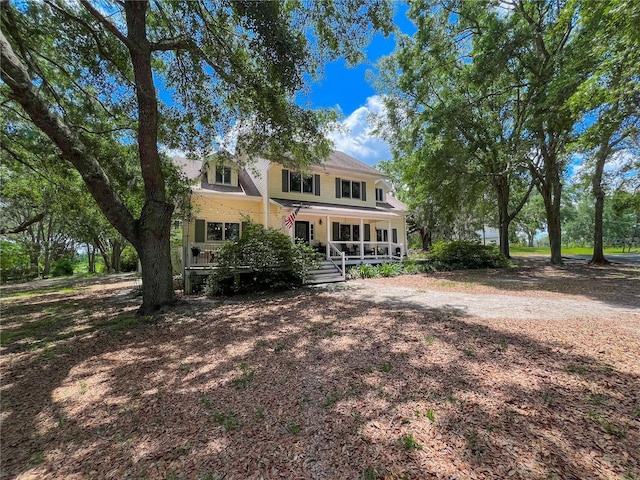 rear view of house with a porch