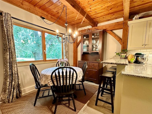 dining area with wood ceiling, a chandelier, beam ceiling, and light tile patterned floors