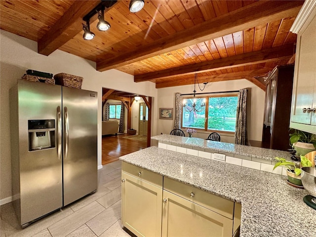 kitchen with stainless steel fridge with ice dispenser, wood ceiling, arched walkways, healthy amount of natural light, and a peninsula