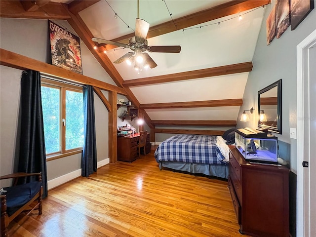 bedroom featuring wood finished floors, baseboards, and a ceiling fan