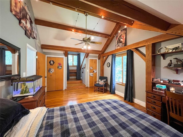 bedroom featuring wood finished floors and baseboards