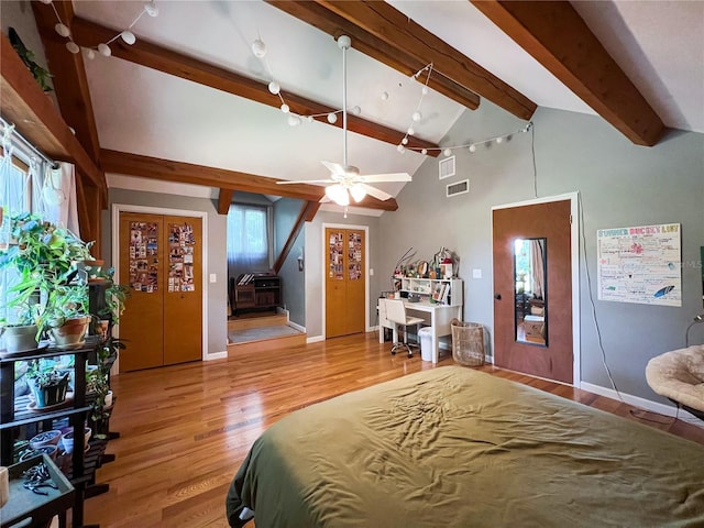 bedroom featuring wood finished floors and baseboards