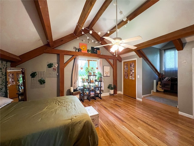 bedroom featuring light wood finished floors and baseboards