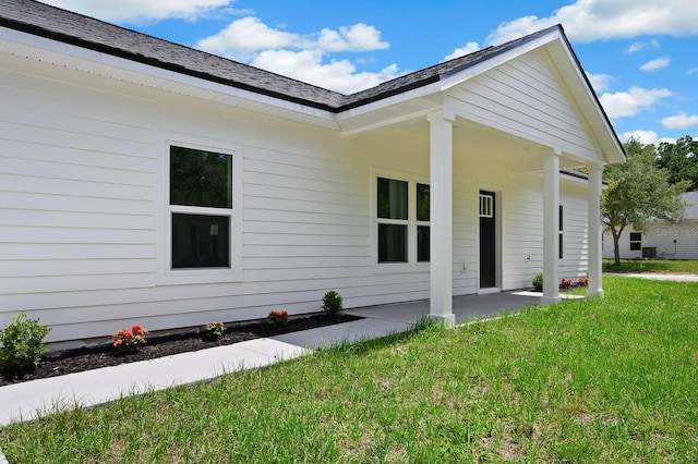back of property with a yard