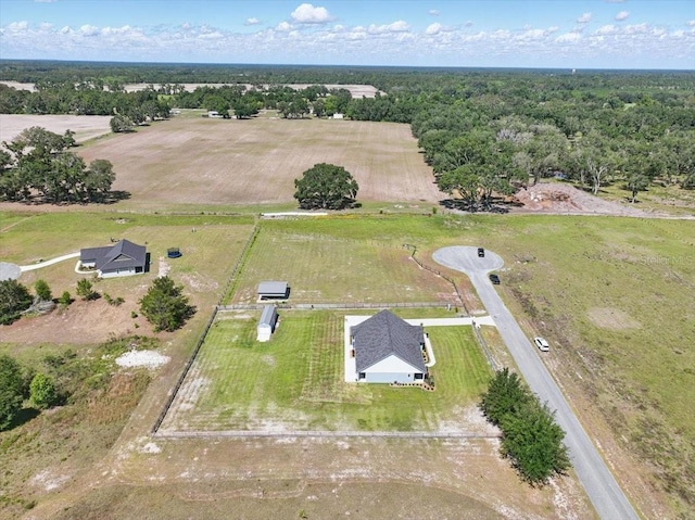 aerial view of property and surrounding area featuring rural landscape