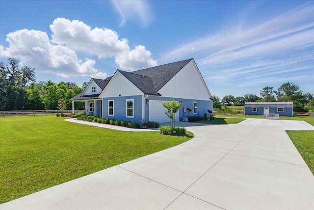 modern farmhouse style home with driveway, board and batten siding, and a garage