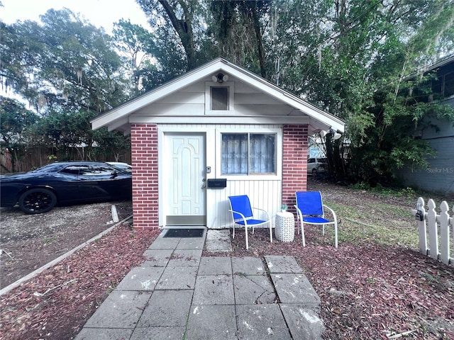 113 NW 11th St Unit 1/2, Gainesville, FL 32601 - view of outdoor structure with fence and an outbuilding