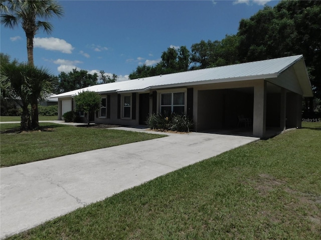 721 Town Ct Unit A & B, Bronson, FL 32621 - ranch-style home with concrete driveway, a garage, a front yard, and metal roof
