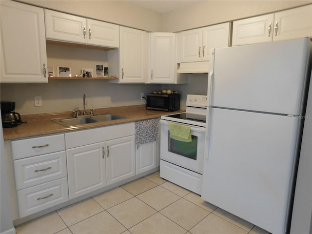 721 Town Ct Unit A & B, Bronson, FL 32621 - kitchen with white appliances, a sink, under cabinet range hood, light tile patterned flooring, and white cabinets