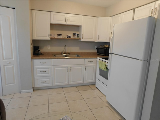 721 Town Ct Unit A & B, Bronson, FL 32621 - kitchen featuring white appliances, a sink, white cabinets, and light tile patterned flooring