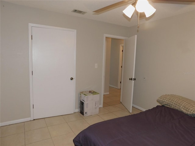 721 Town Ct Unit A & B, Bronson, FL 32621 - bedroom with light tile patterned floors, baseboards, and a ceiling fan