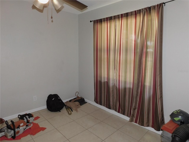 721 Town Ct Unit A & B, Bronson, FL 32621 - empty room featuring ceiling fan, light tile patterned floors, and baseboards