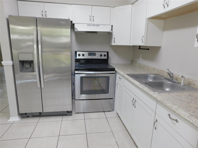 721 Town Ct Unit A & B, Bronson, FL 32621 - kitchen with stainless steel appliances, under cabinet range hood, a sink, white cabinetry, and light tile patterned flooring