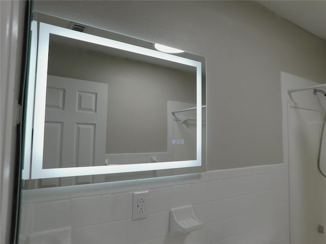 721 Town Ct Unit A & B, Bronson, FL 32621 - full bath featuring a shower and a wainscoted wall