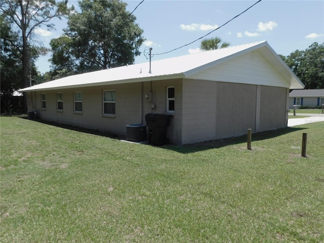 721 Town Ct Unit A & B, Bronson, FL 32621 - rear view of property featuring a lawn and metal roof