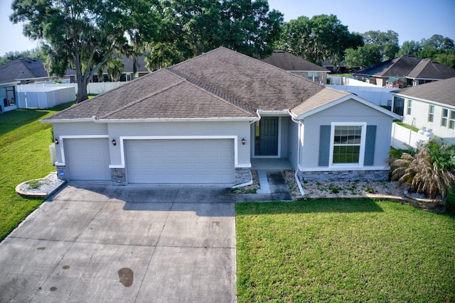 4261 SW 62nd Loop, Ocala, FL 34474 - ranch-style house featuring stone siding, stucco siding, a garage, driveway, and a shingled roof