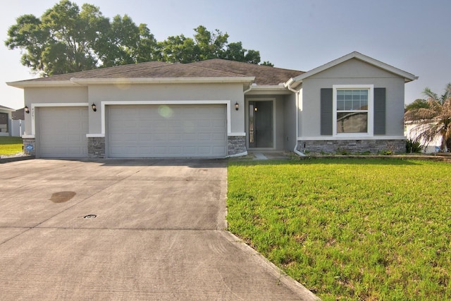4261 SW 62nd Loop, Ocala, FL 34474 - single story home featuring stone siding, stucco siding, an attached garage, driveway, and a front lawn