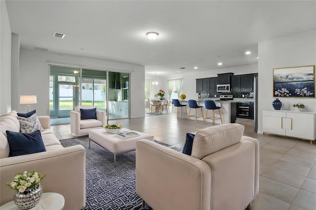4261 SW 62nd Loop, Ocala, FL 34474 - living area with light tile patterned floors and recessed lighting