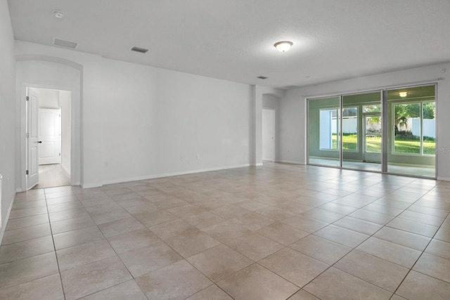 4261 SW 62nd Loop, Ocala, FL 34474 - unfurnished room with light tile patterned flooring and baseboards