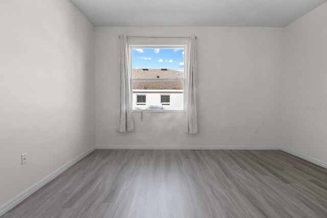 4261 SW 62nd Loop, Ocala, FL 34474 - spare room featuring wood finished floors and baseboards